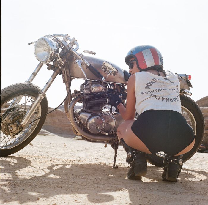 A playful frame from Girls on a motorcycle — online in Johannesburg